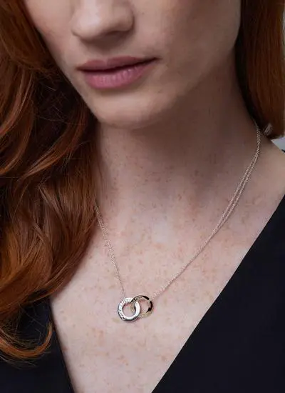 Close up shot of red haired model wearing 9ct Gold 